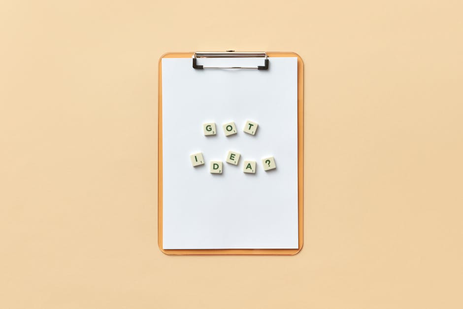 Clipboard with 'Got Idea?' spelled with letter tiles on neutral background.